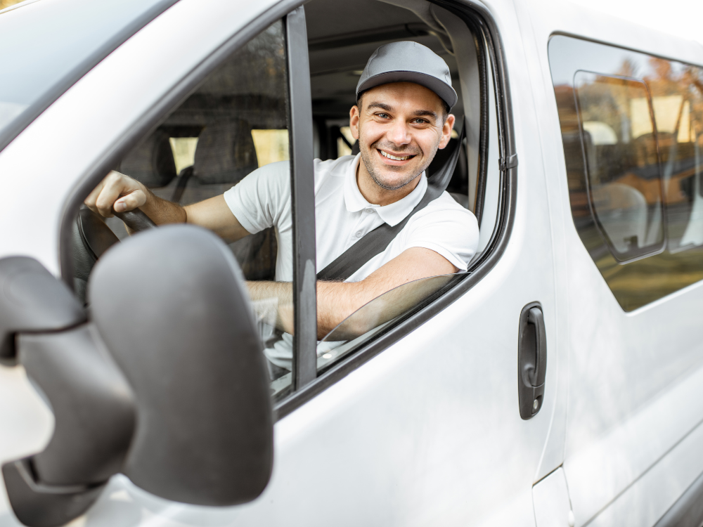 CompuCycle driver in cab of secure IT asset pickup truck